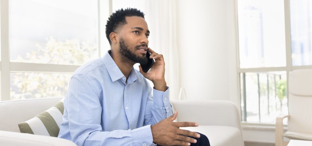 A young man talking on the phone.