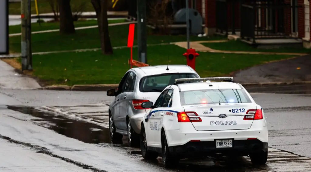 A police car stop a vehicle.